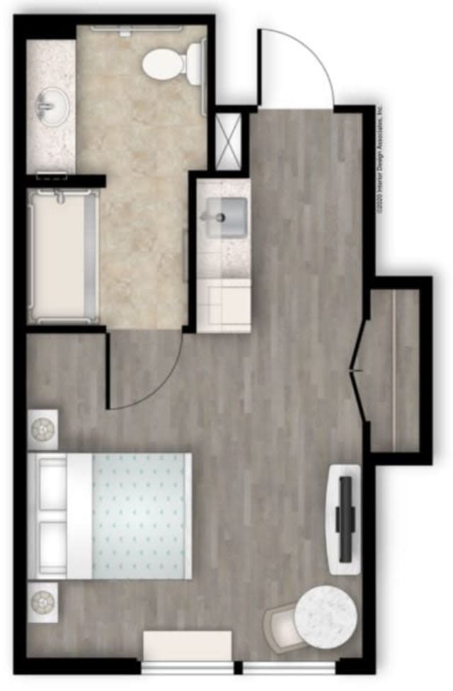 A compact apartment floor plan featuring a bedroom, bathroom, kitchen, and living area.