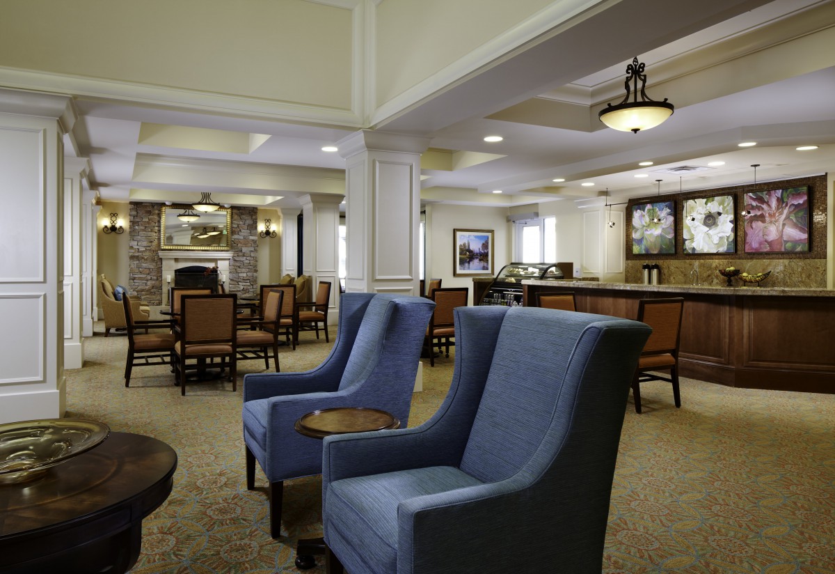 A cozy lounge area featuring comfortable seating and elegant decor.