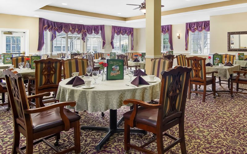 Elegant dining area with neatly arranged tables and chairs.