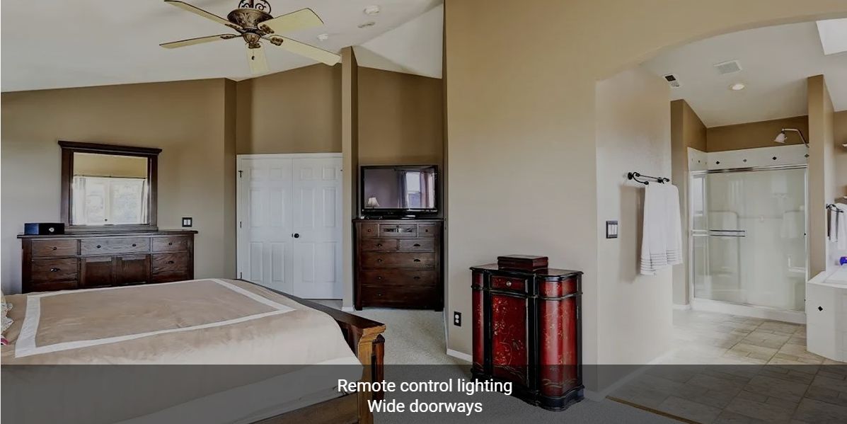 Modern bedroom with remote control lighting and wide doorways.