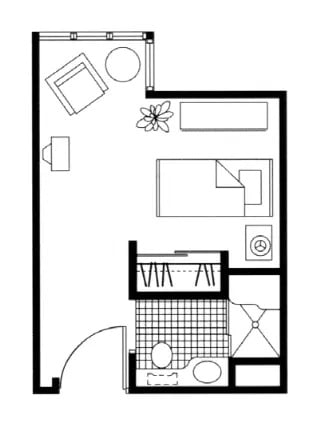 This is a floor plan of a studio apartment featuring an open living area with a bed, seating, and kitchenette, and a separate bathroom.