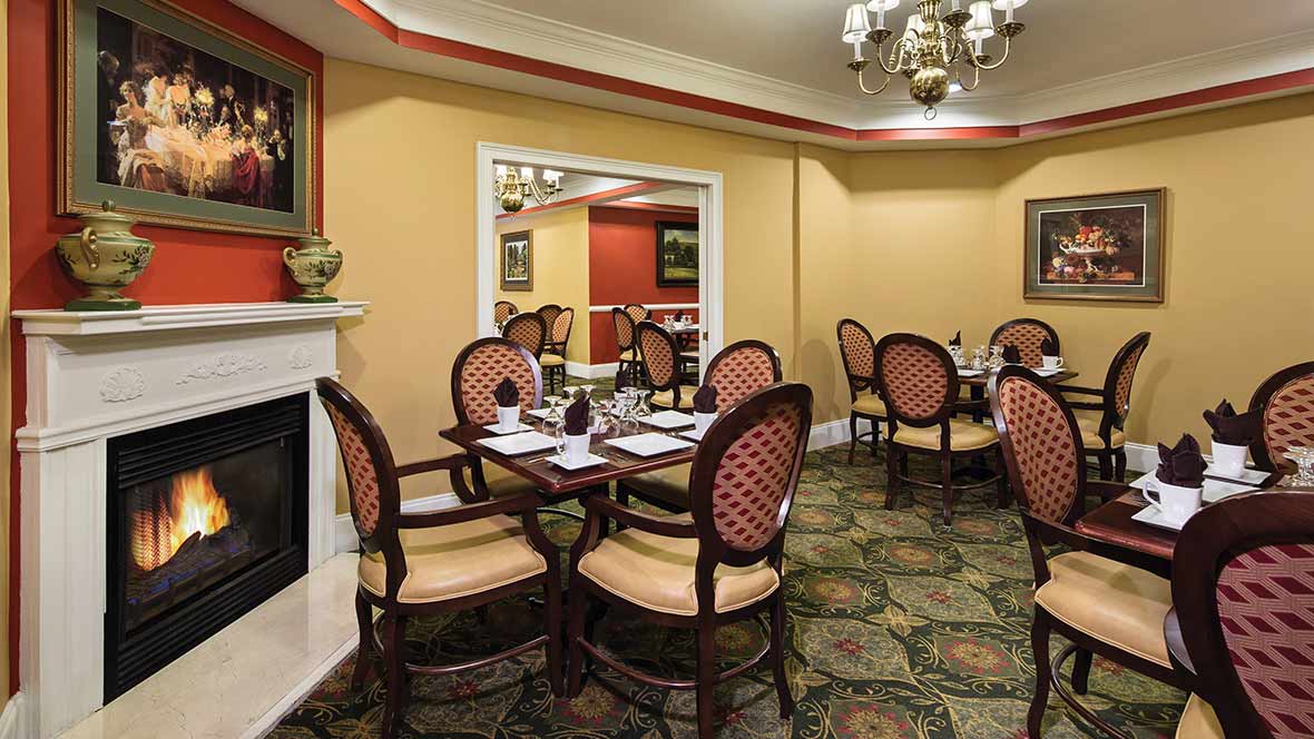 A classic-style dining area with elegant furnishings and a warm color palette.