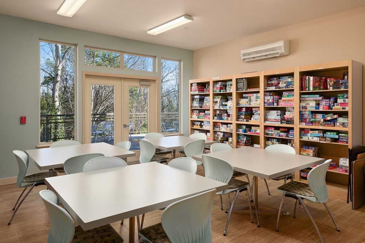A quiet study room with bookshelves and tables for reading.