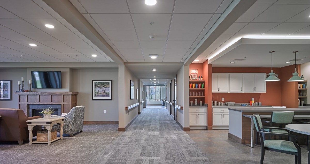 A modern office hallway with bright lighting and a clean design.