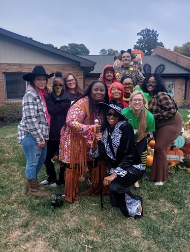 A fun gathering of friends in creative costumes celebrating Halloween.