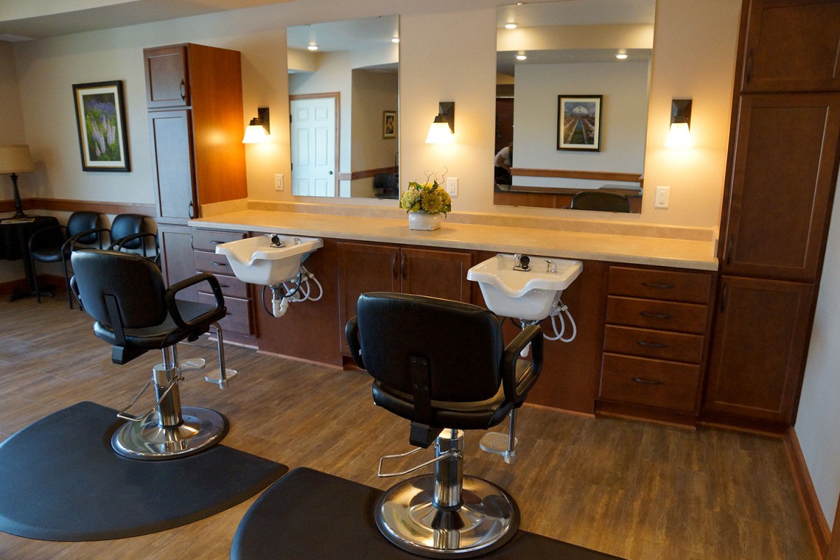 A well-appointed hair salon with chairs, mirrors, and sinks.