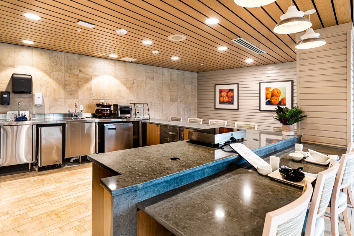 A modern kitchen interior with sleek countertops and appliances.