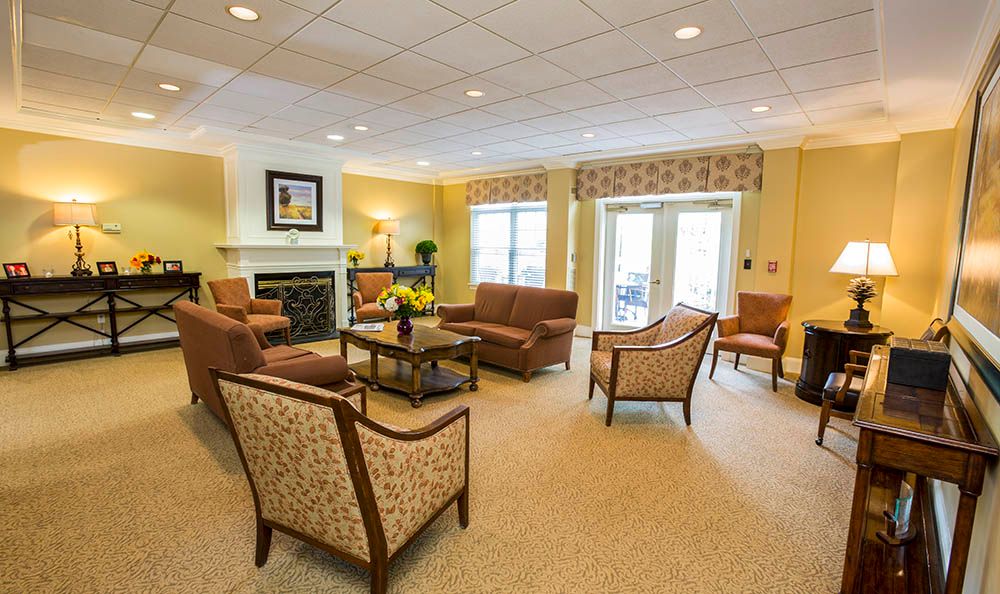 A cozy living room with comfortable seating and a fireplace.