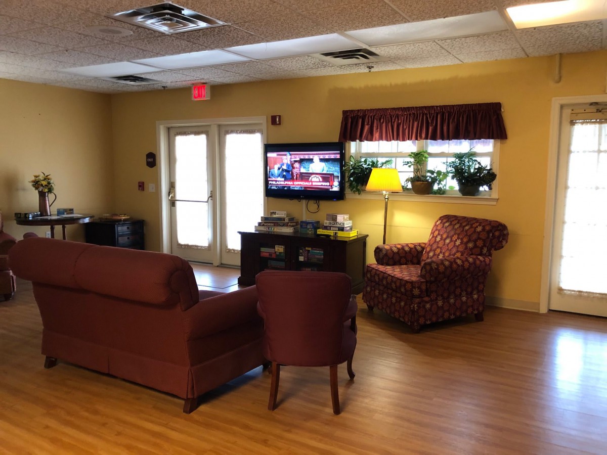 A cozy living room with comfortable seating and a television.