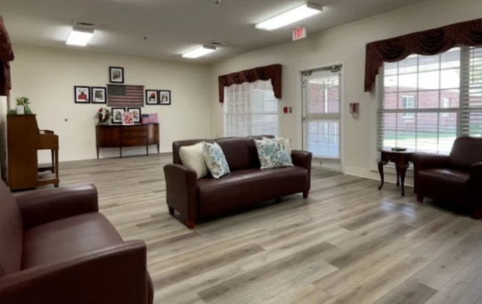 A modern living room with brown sofas and stylish decor.