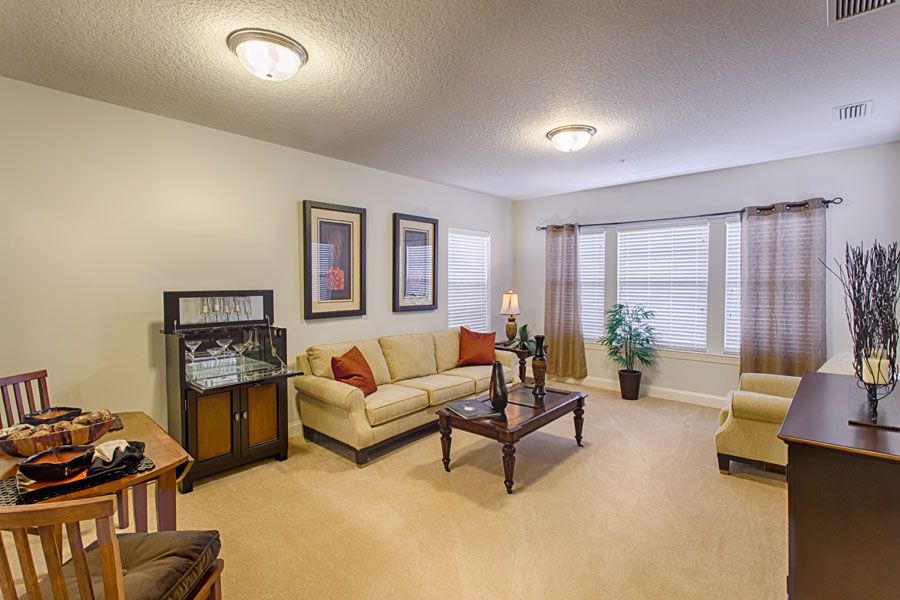 A cozy living room with comfortable seating and elegant decor.