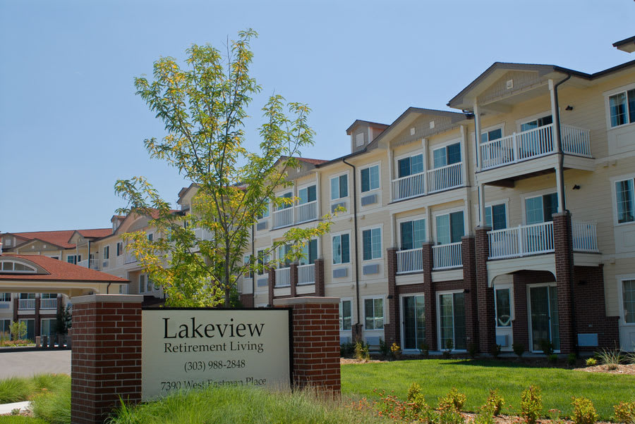 Exterior view of Lakeview Retirement Living building with a welcoming sign.