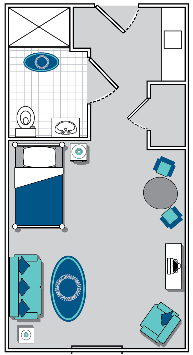A floor plan of a small room with a bed, bathroom, and seating area.