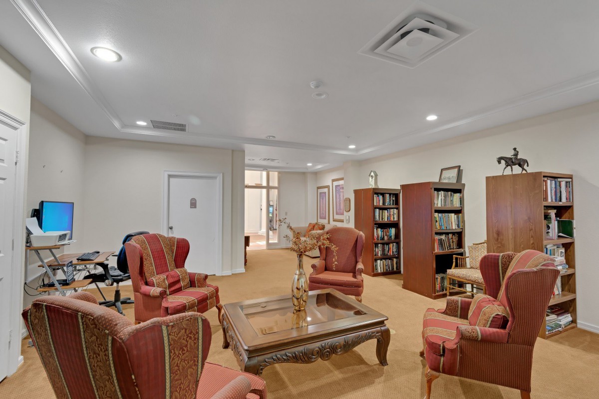 A cozy library interior with comfortable chairs and bookshelves.