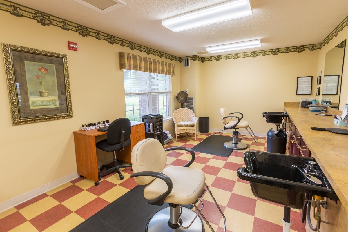 A well-organized salon with styling chairs and equipment ready for use.