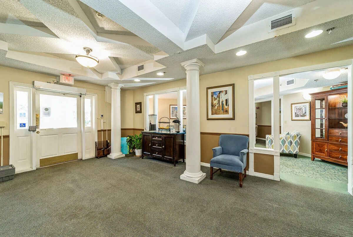 A well-lit lobby area with seating and decorative elements.