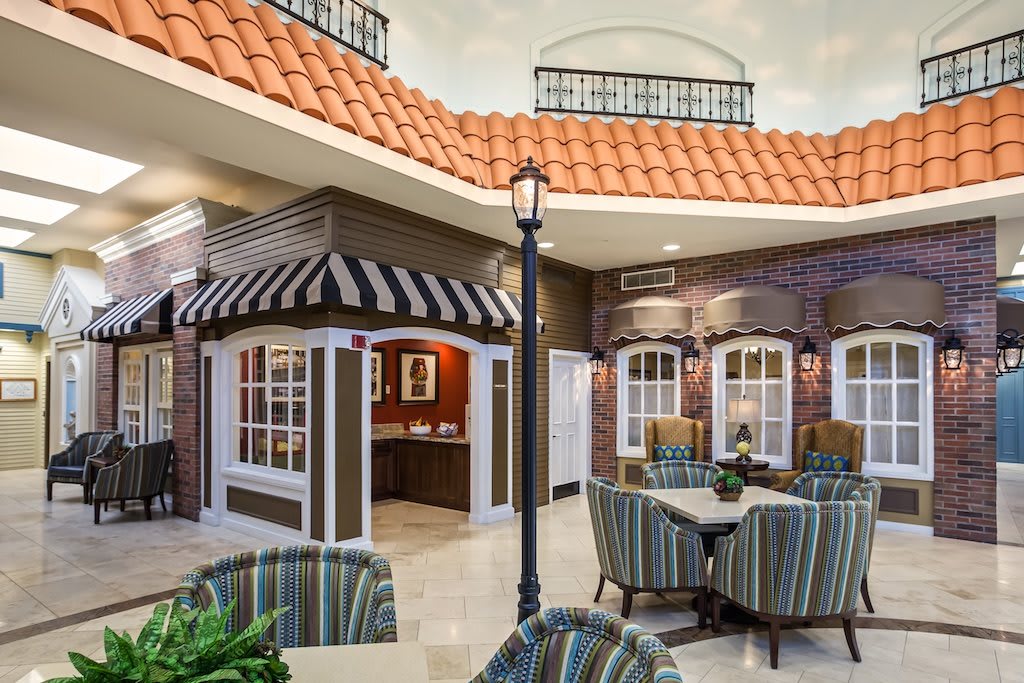 A stylish indoor dining area with elegant seating and a unique architectural design.
