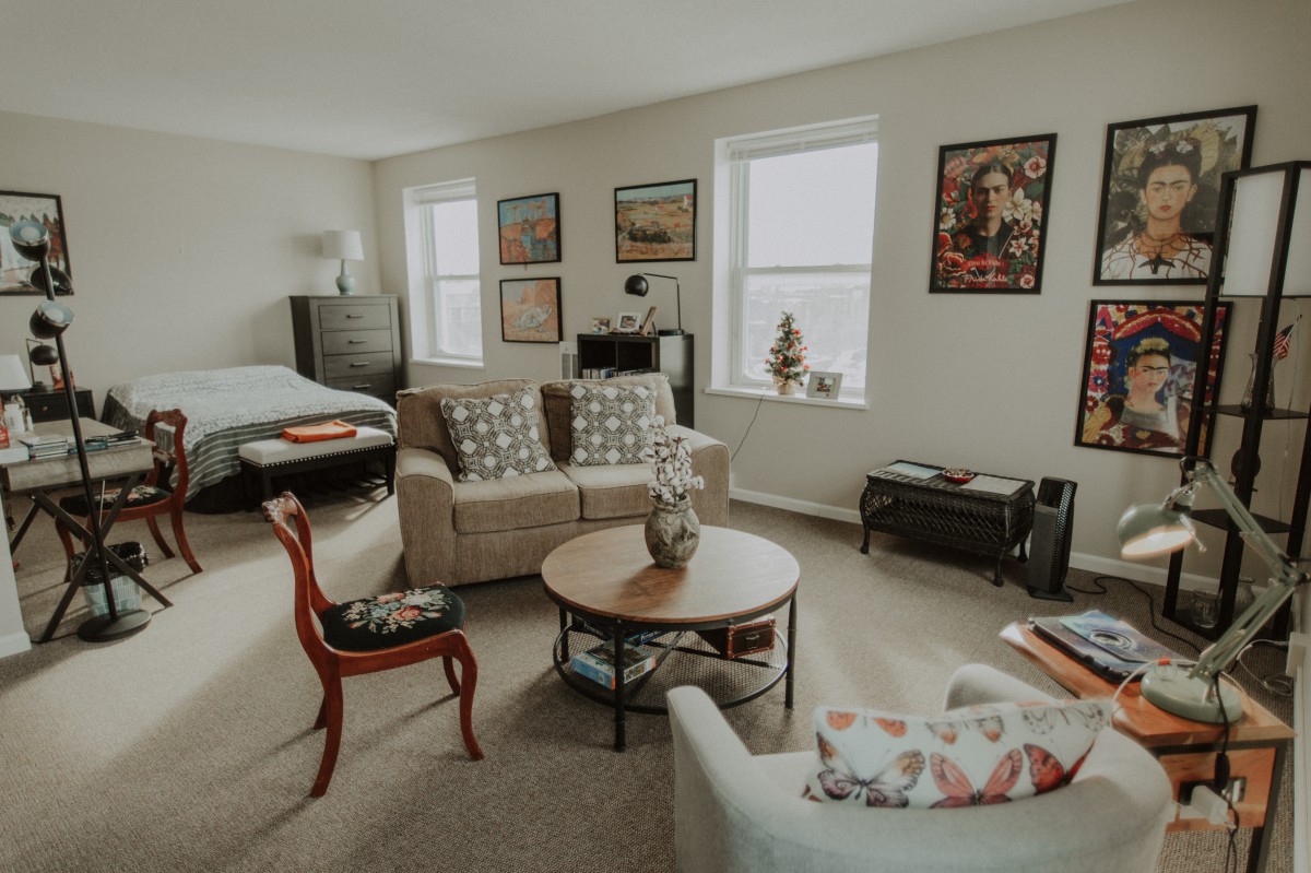A cozy and modern living room with stylish furniture and art on the walls.
