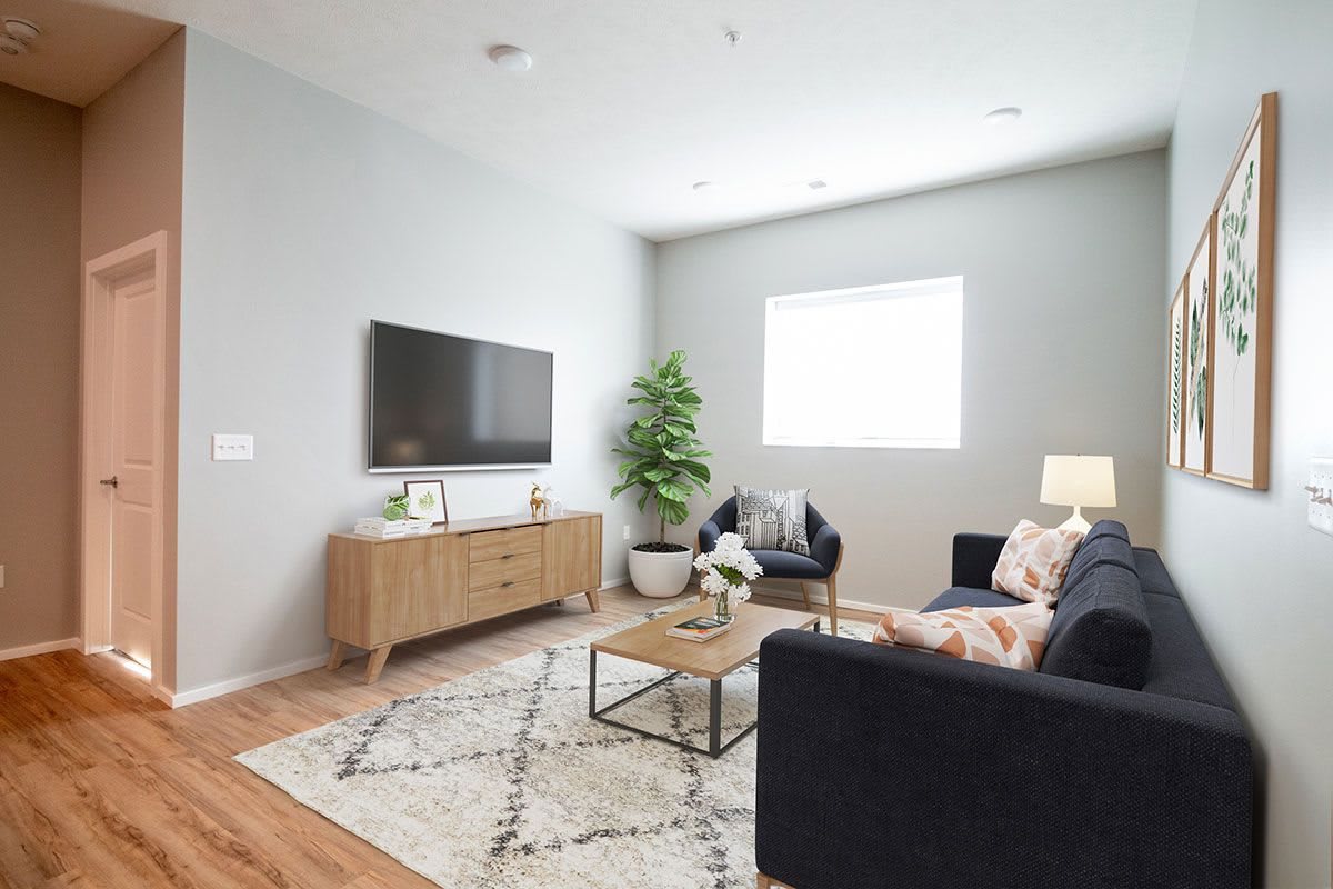 A modern living room with sleek furniture and a cozy atmosphere.