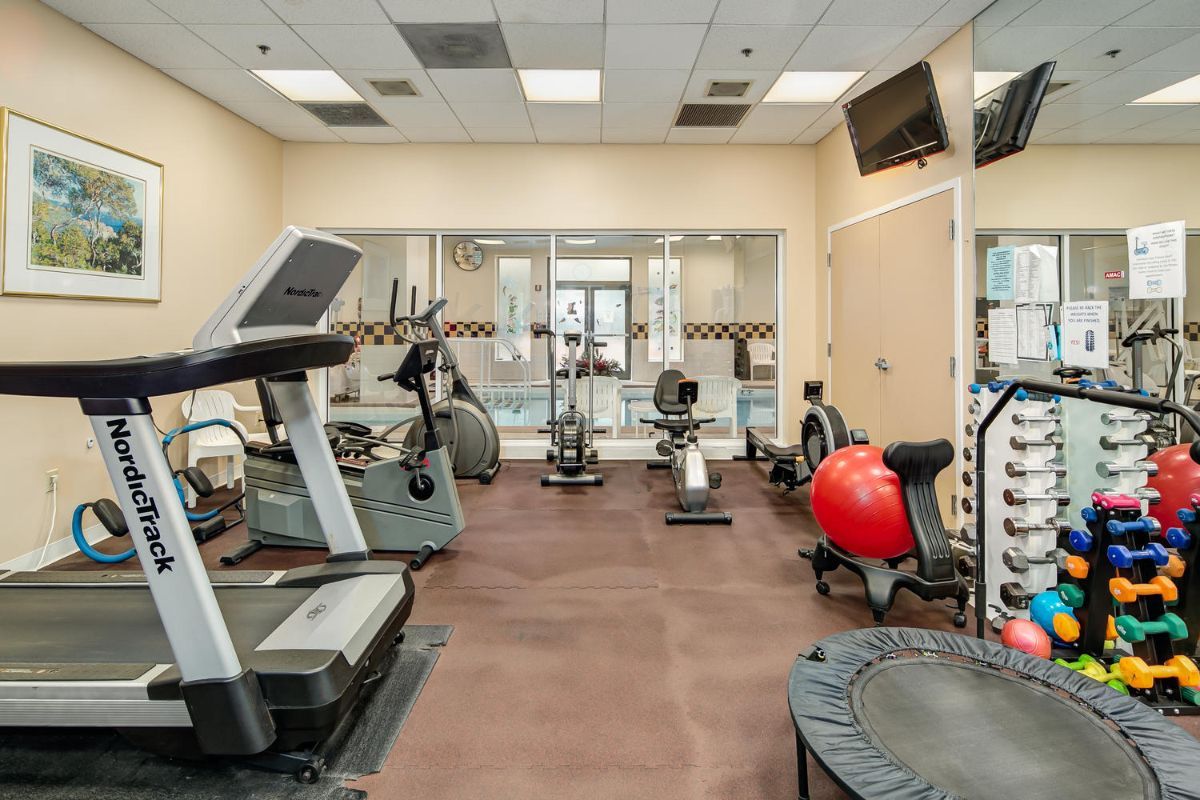 A well-equipped gym with various fitness machines and equipment.