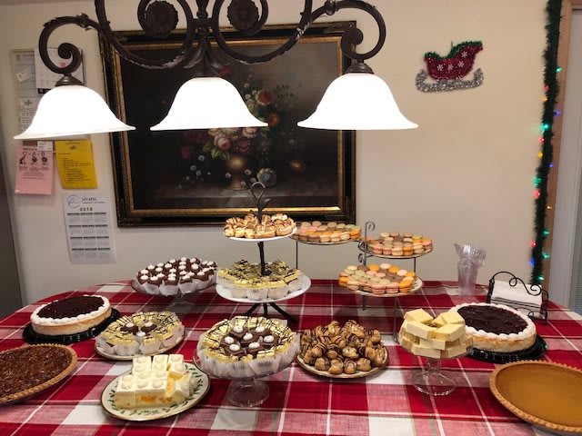An inviting dessert buffet with a variety of sweets and pastries elegantly displayed on a table.