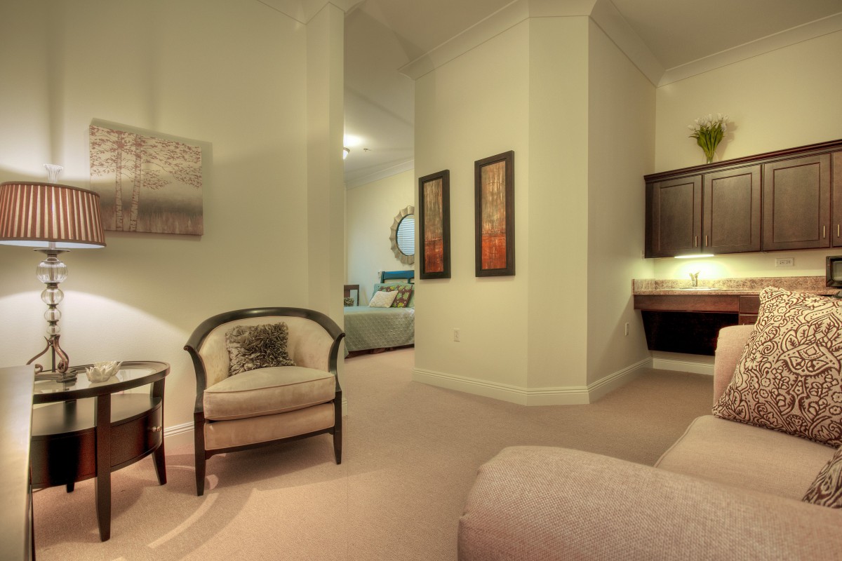 A cozy living room with elegant furniture and warm lighting.