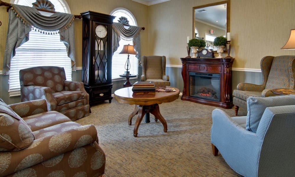 A cozy living room with elegant furniture and a fireplace.