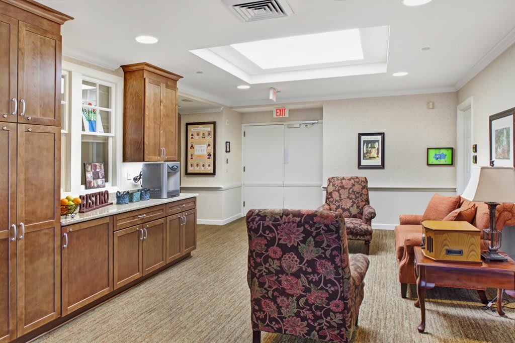 A cozy lounge area with comfortable seating and decorative elements.