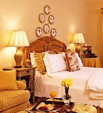A cozy bedroom with warm lighting and classic decor.