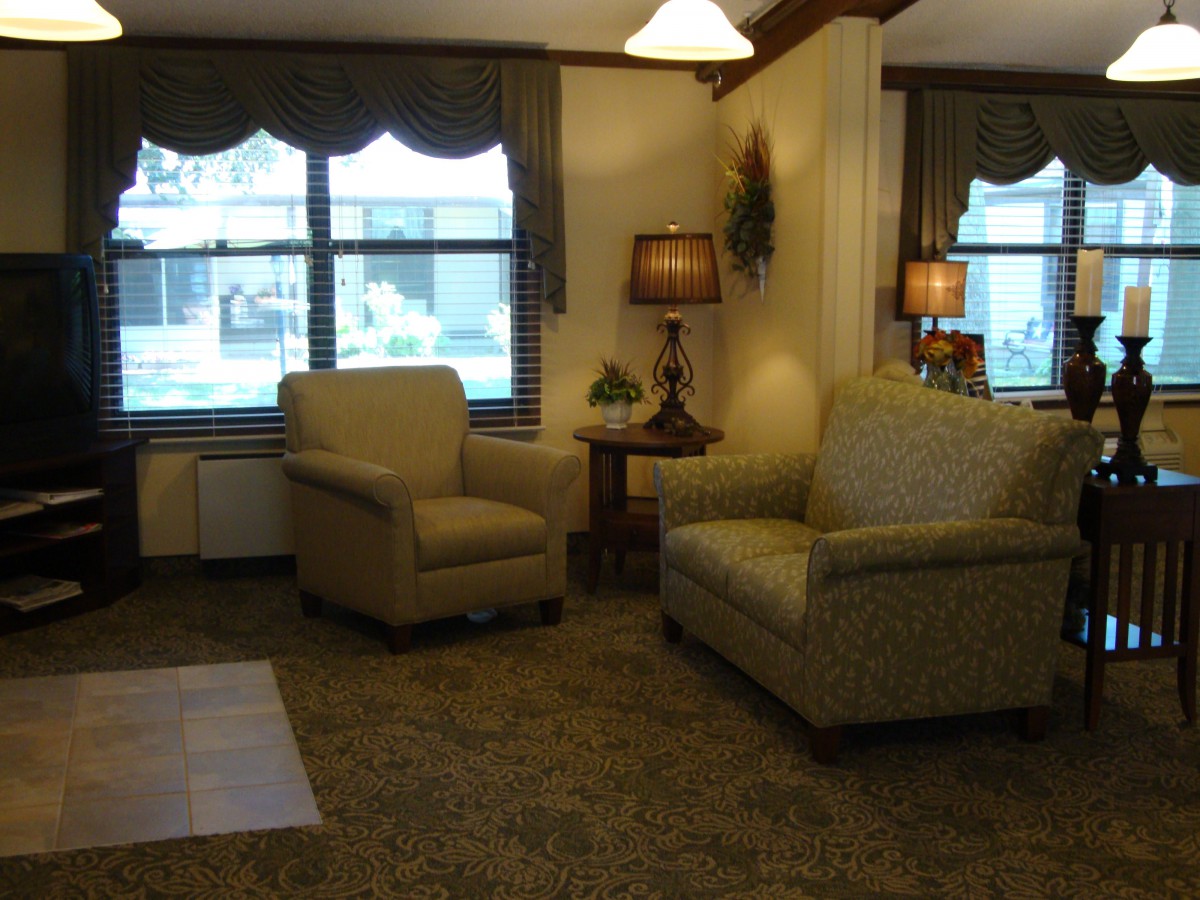 A cozy living room with comfortable seating and warm lighting.