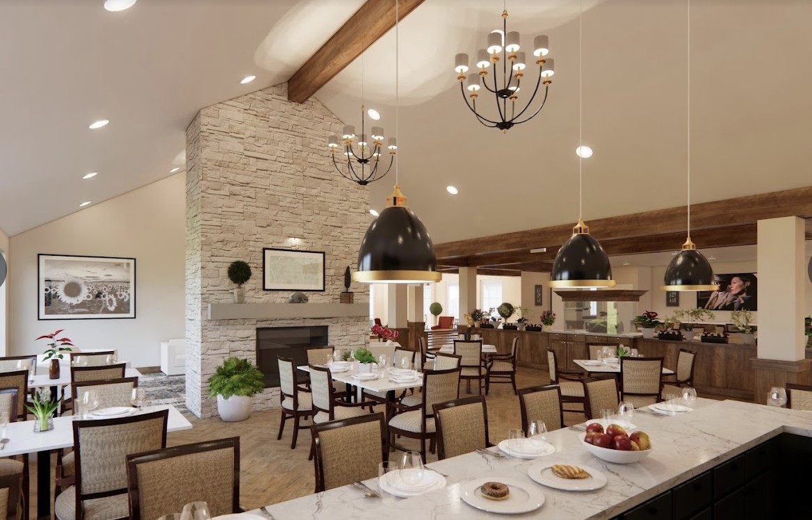 A beautifully designed dining area featuring modern decor with chandeliers and a stone fireplace.