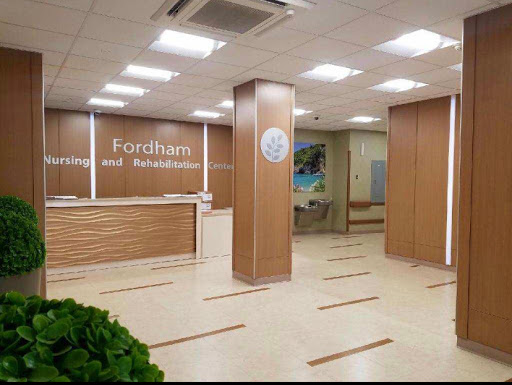 A modern reception area of a medical facility, featuring wooden finishes and a welcoming atmosphere.