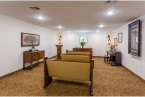 Spacious room with seating and elegant decor.