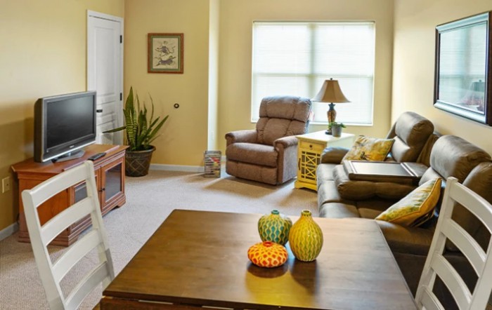 A cozy living room with comfortable seating and natural light.