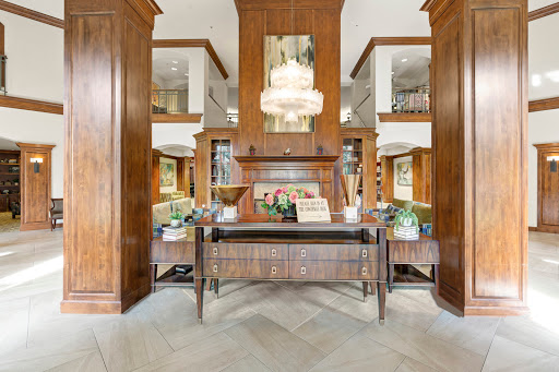A beautifully designed entryway featuring elegant wood paneling and stylish furnishings.