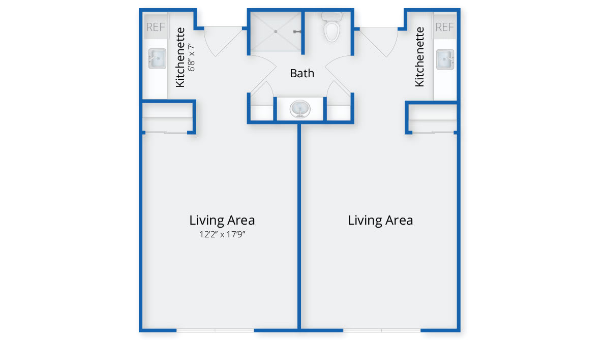 Floor plan of a studio apartment with separate kitchenettes and bathrooms for each unit.