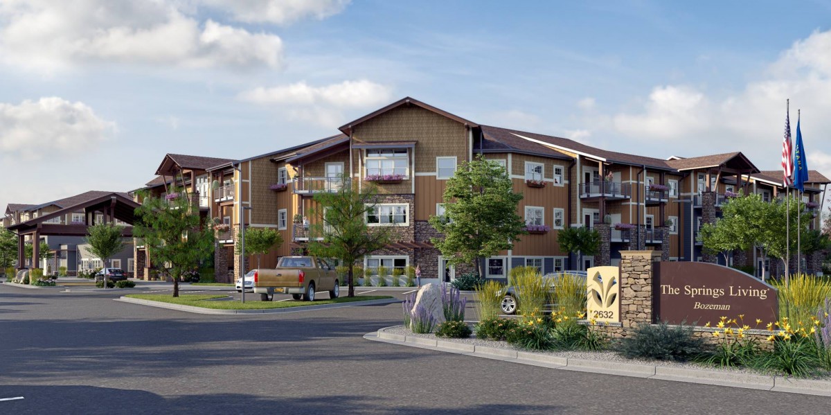 A modern residential apartment building surrounded by well-maintained landscaping.