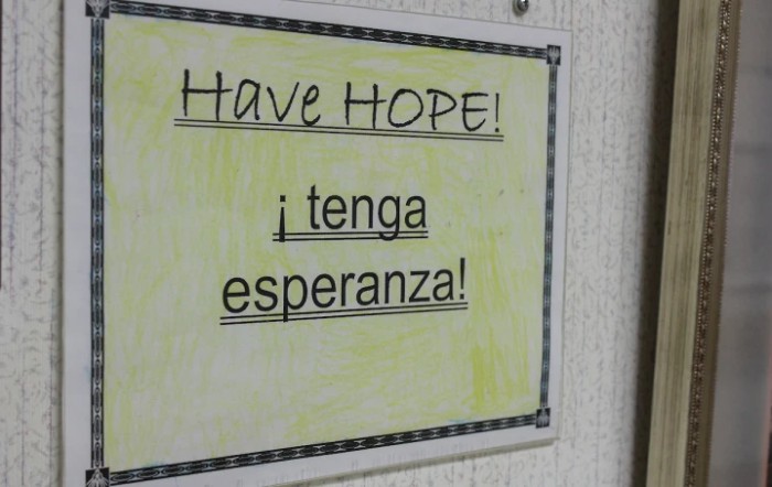 A motivational sign with 'Have Hope' in English and Spanish.