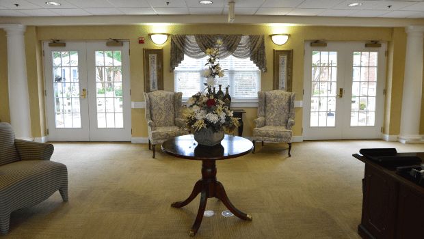 Elegant sitting area with a floral centerpiece and classic decor.