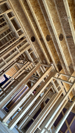 Interior view of a construction site showcasing the wooden framing.