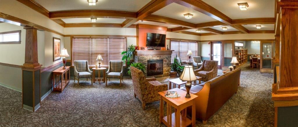 A cozy living room with a fireplace, television, and comfortable seating.