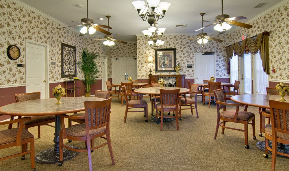 A cozy dining area with wooden furniture and elegant chandeliers.