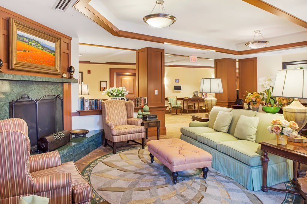 A cozy living room with elegant furniture and a fireplace.