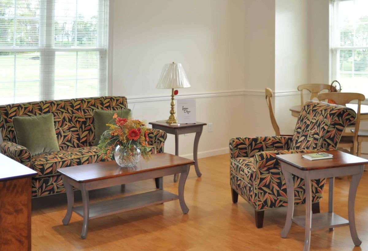 A cozy living room with patterned furniture and elegant decor.