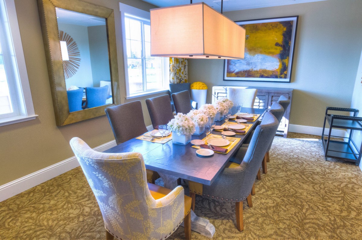 A stylish dining room with an elegant table setting and contemporary decor.