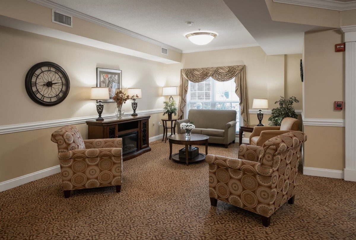 A cozy living room with elegant furniture and warm lighting.