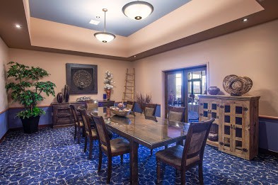 Elegant dining room with a large table and stylish decor.
