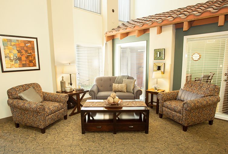 A cozy living room with comfortable seating and elegant decor.
