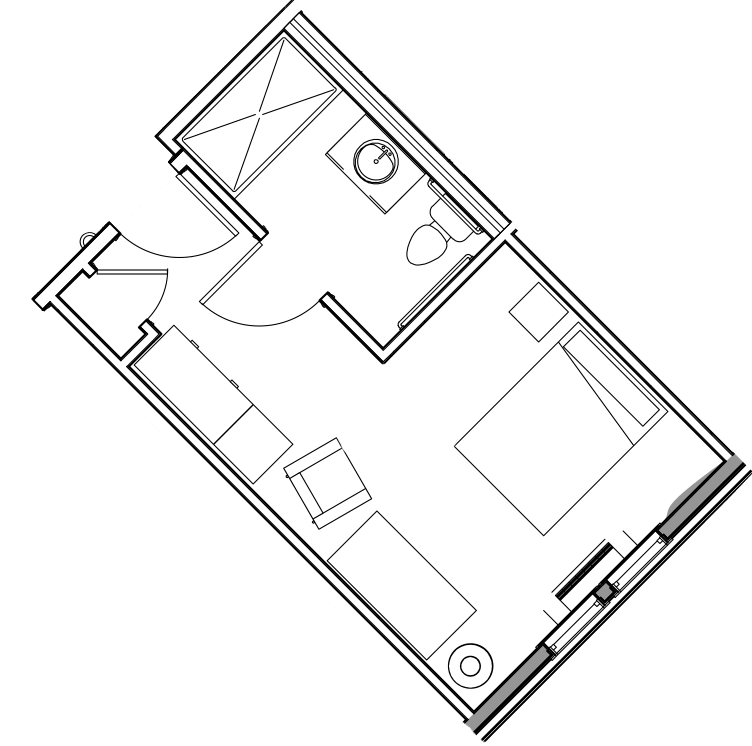 A floor plan of a compact studio apartment with a small bathroom, bed, and seating area.