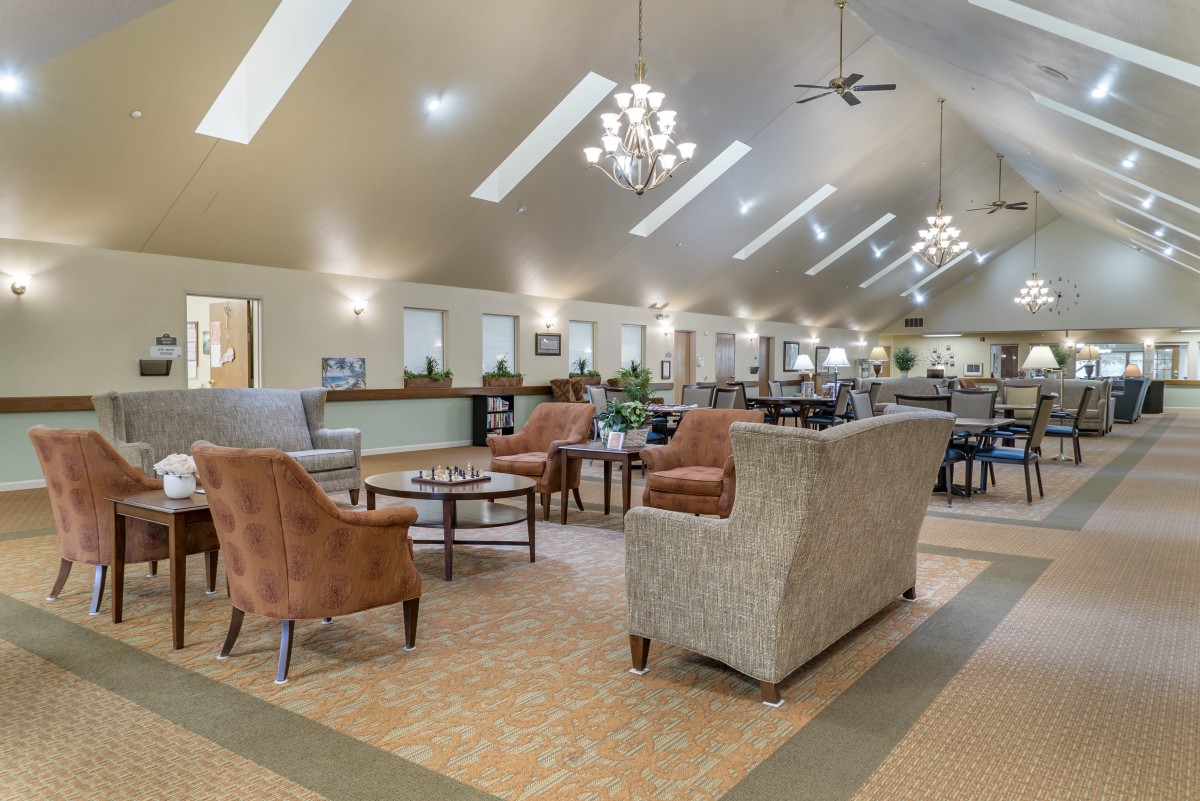 A spacious and modern lounge area with comfortable seating and elegant lighting.